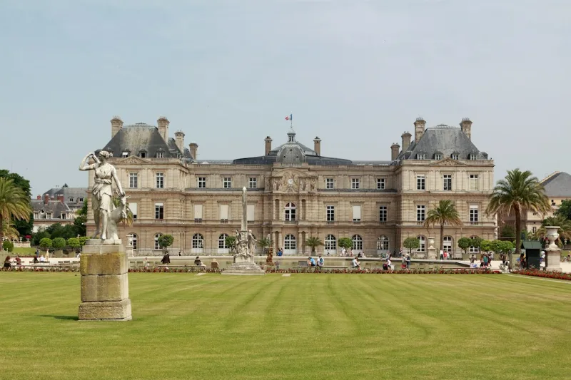 a large building with a statue in front of it